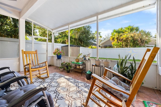 sunroom featuring vaulted ceiling