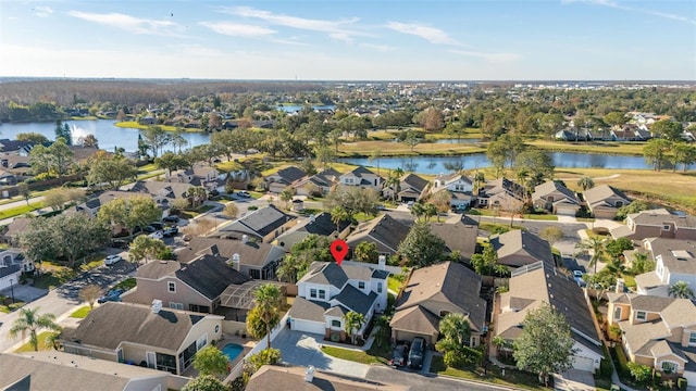 birds eye view of property with a water view