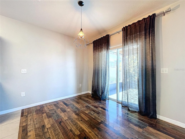 empty room featuring dark hardwood / wood-style floors