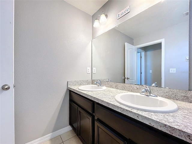 bathroom with tile patterned flooring and vanity