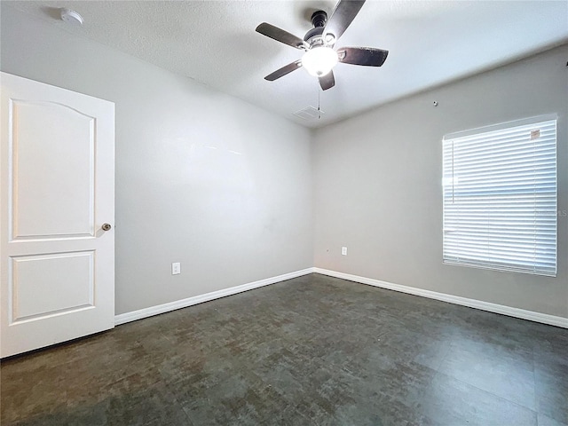 unfurnished room with ceiling fan