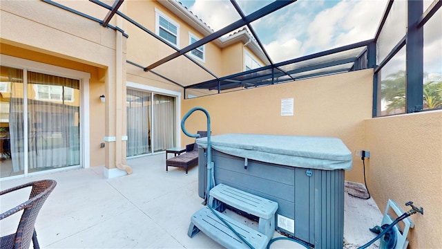 view of patio / terrace with a hot tub