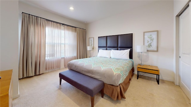 carpeted bedroom with a closet