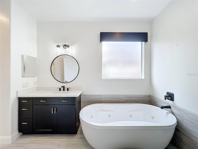 bathroom with vanity and a bathing tub