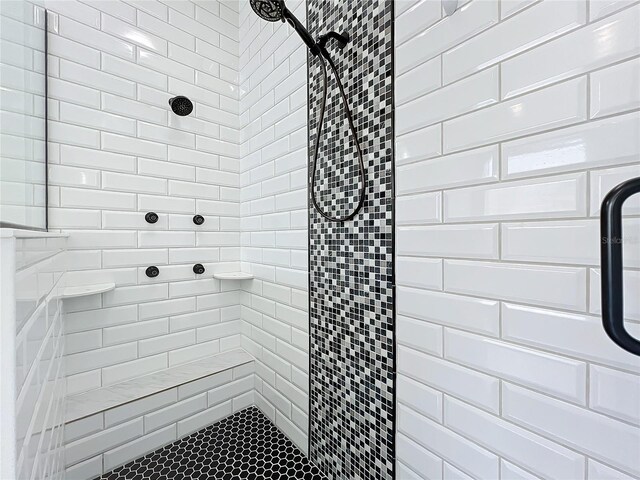 bathroom with a tile shower