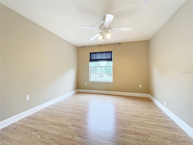 empty room with light hardwood / wood-style floors and ceiling fan