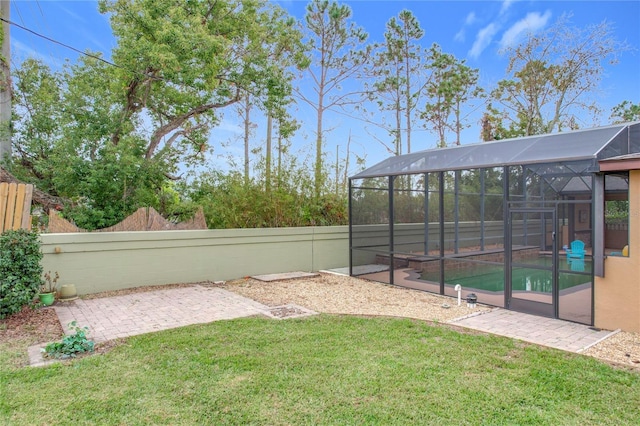 view of yard featuring a lanai and a patio