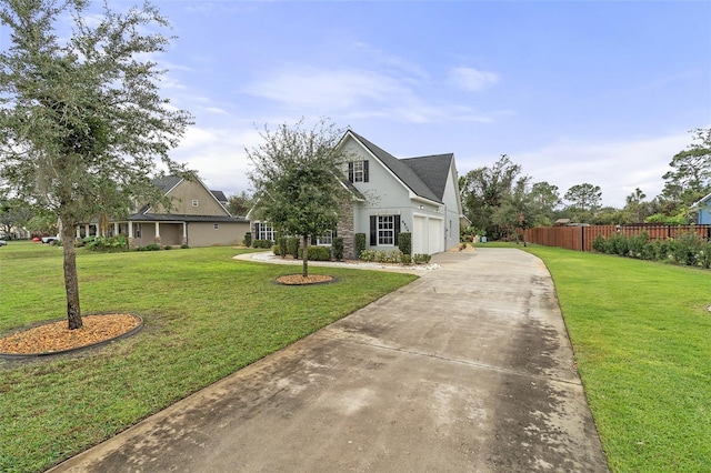 view of front of property with a front yard and a garage