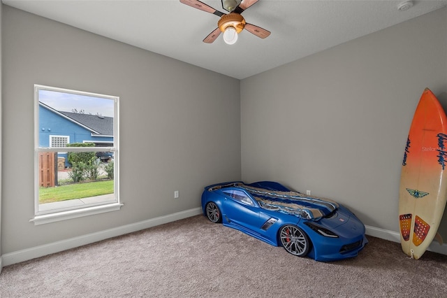 carpeted bedroom with ceiling fan