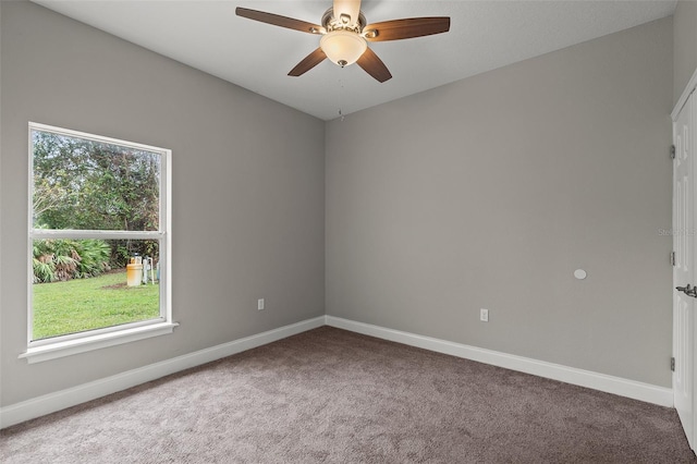 carpeted empty room with ceiling fan