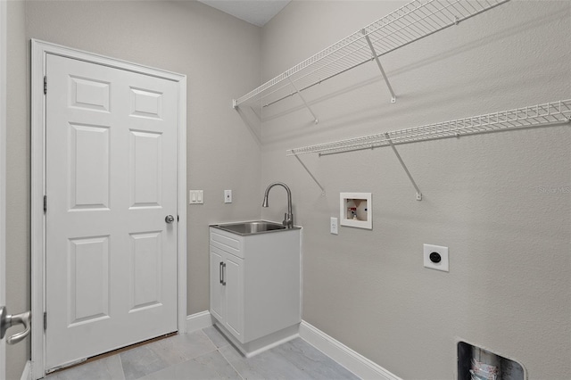 washroom featuring hookup for an electric dryer, hookup for a washing machine, cabinets, sink, and light tile patterned flooring