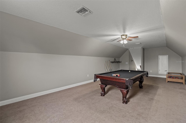 playroom with carpet, vaulted ceiling, ceiling fan, a textured ceiling, and pool table