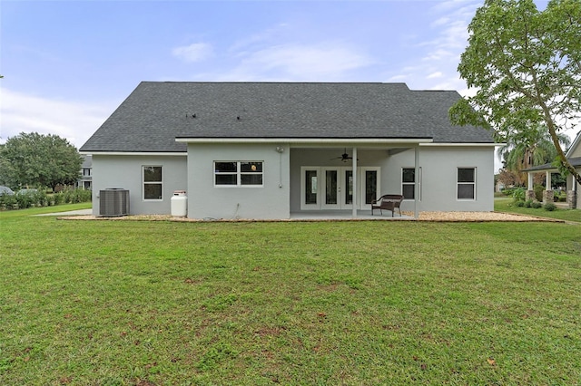 back of house featuring a lawn, central AC, ceiling fan, and a patio