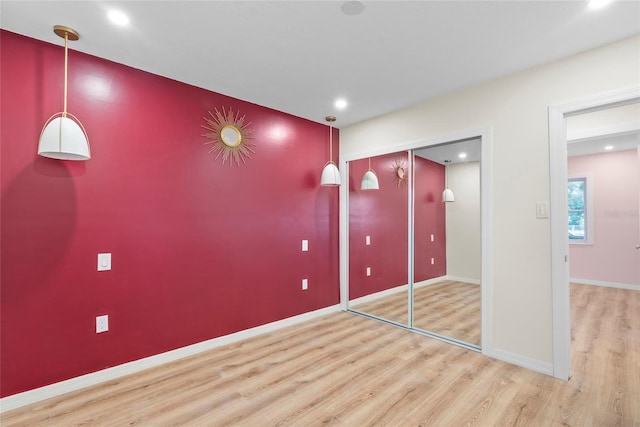 interior space with hardwood / wood-style flooring and a closet