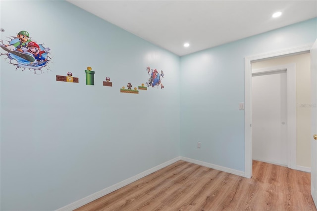 spare room featuring light wood-type flooring