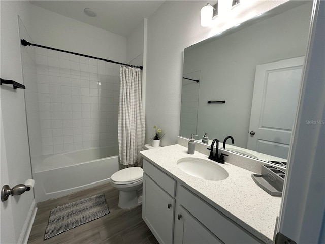 bathroom with shower / bath combination with curtain, vanity, toilet, and wood finished floors