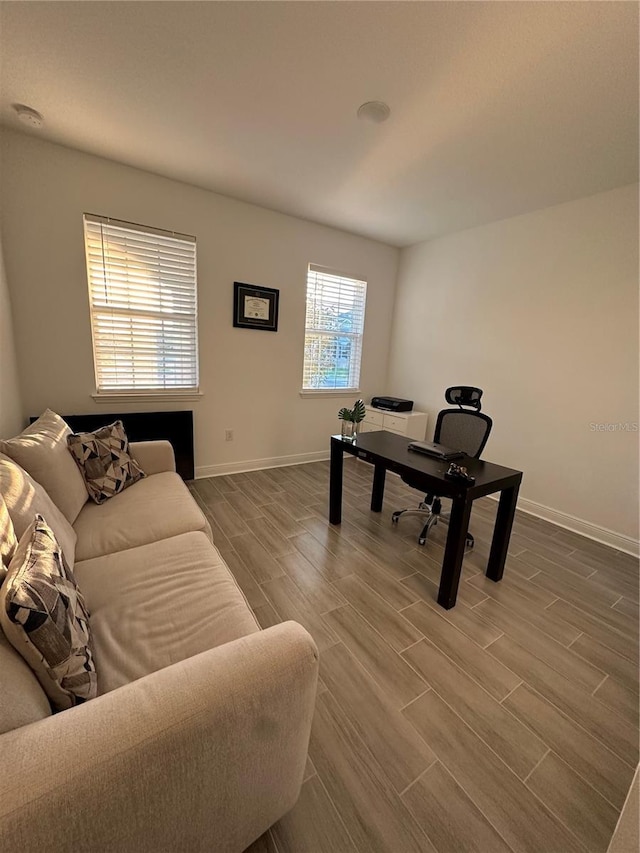 home office with wood tiled floor and baseboards