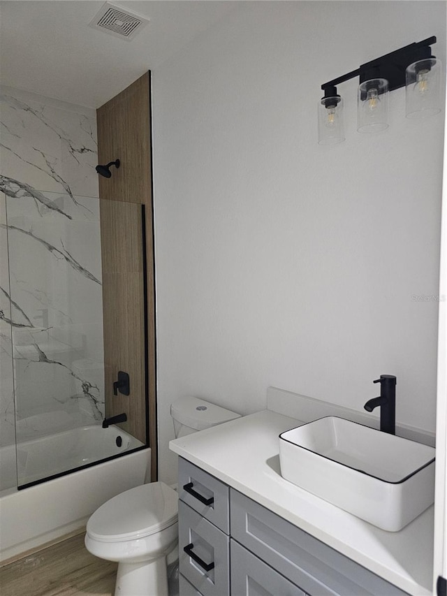 8249 Dimstead St, Port Charlotte, FL 33981 - full bathroom with vanity, shower / tub combination, and wood finished floors
