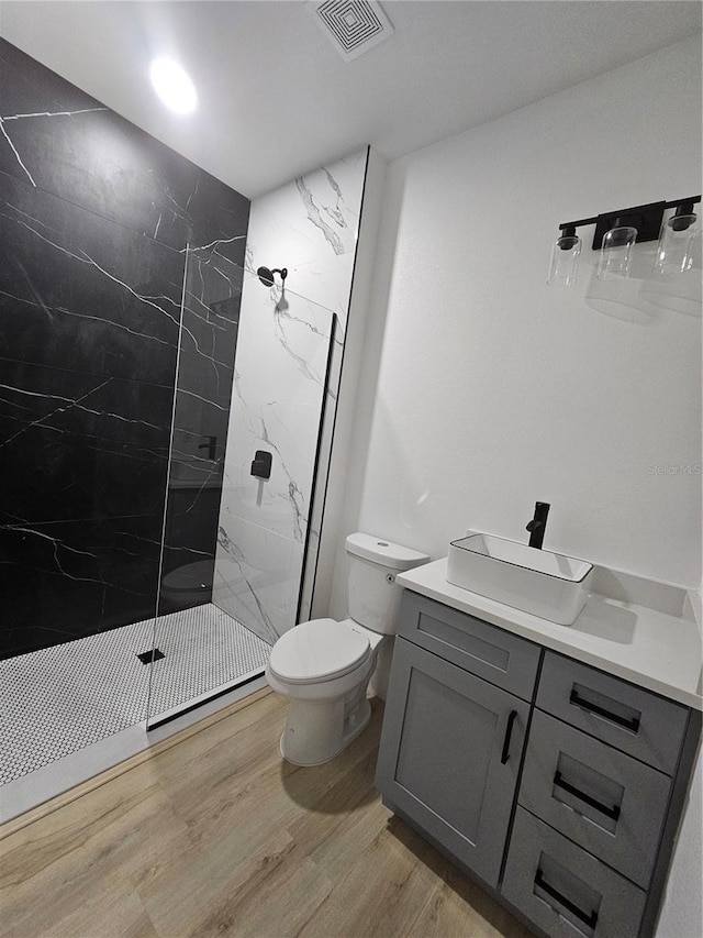 8249 Dimstead St, Port Charlotte, FL 33981 - full bath with vanity, a marble finish shower, and wood finished floors