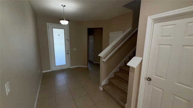 foyer featuring light tile patterned floors