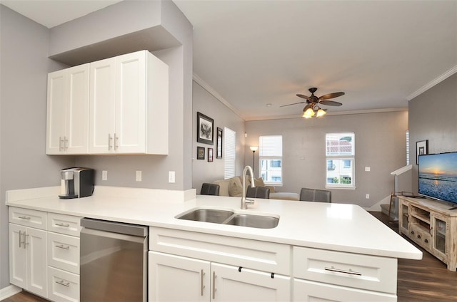 kitchen featuring kitchen peninsula, dishwasher, sink, and crown molding