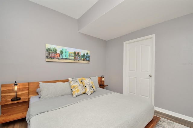 bedroom featuring dark wood-type flooring