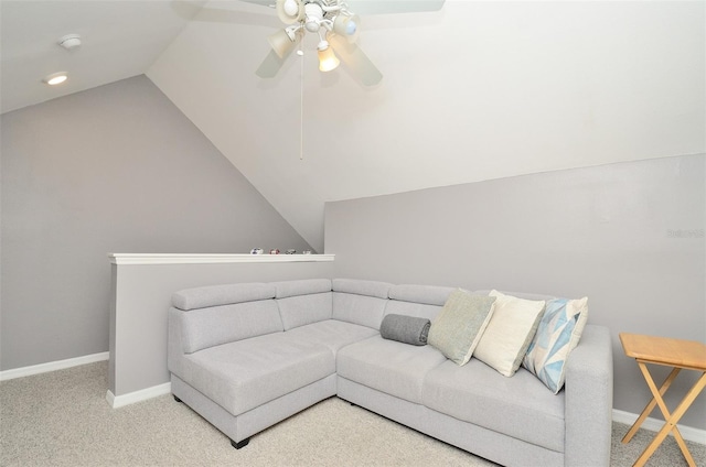 living room with carpet, ceiling fan, and vaulted ceiling