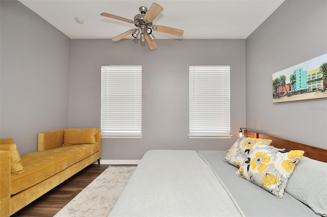 bedroom featuring dark hardwood / wood-style flooring and ceiling fan