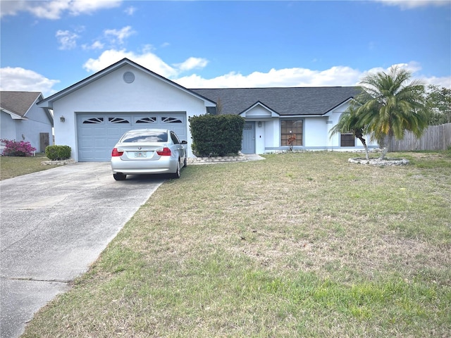 ranch-style house featuring stucco siding, an attached garage, concrete driveway, and a front yard