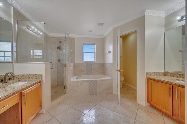 full bathroom with vanity, tile patterned flooring, separate shower and tub, toilet, and ornamental molding