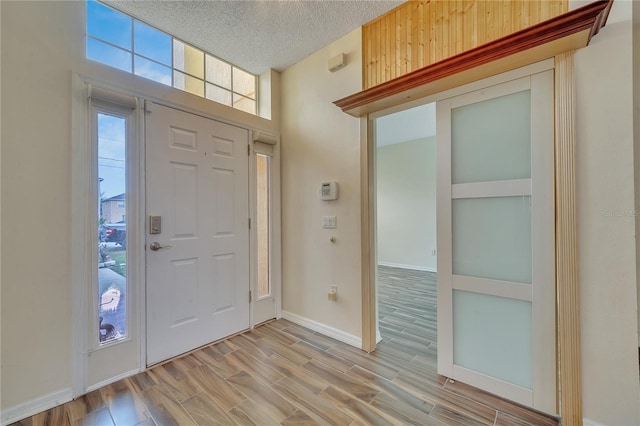 entrance foyer featuring a textured ceiling