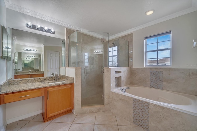 bathroom featuring tile patterned flooring, vanity, independent shower and bath, and ornamental molding