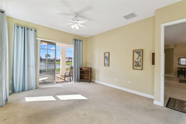 carpeted empty room with ceiling fan