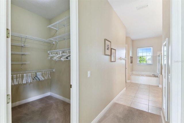 hallway with light tile patterned floors