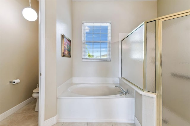 bathroom featuring plus walk in shower, tile patterned flooring, and toilet