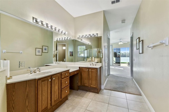 bathroom with tile patterned flooring, ceiling fan, an enclosed shower, and vanity