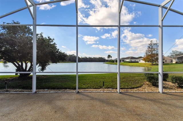 unfurnished sunroom featuring a water view and a healthy amount of sunlight