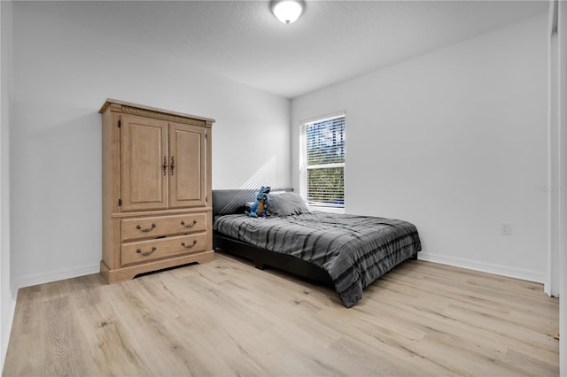 bedroom with light hardwood / wood-style floors