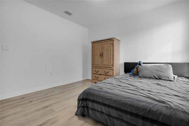 bedroom with light wood-type flooring