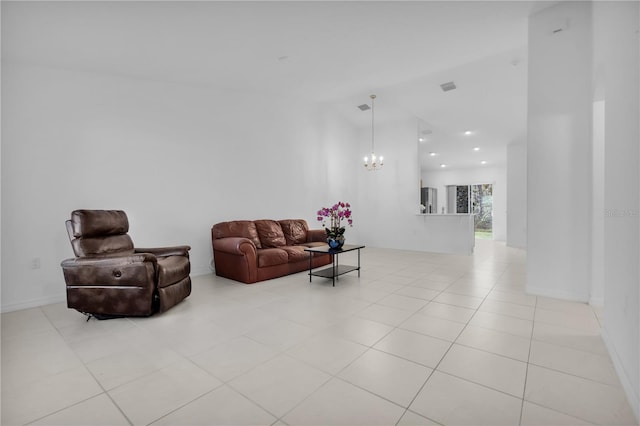 living room featuring light tile patterned floors and a notable chandelier