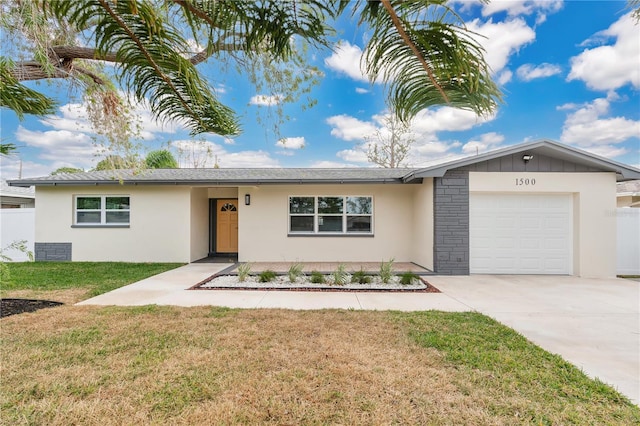 ranch-style house featuring a garage and a front lawn