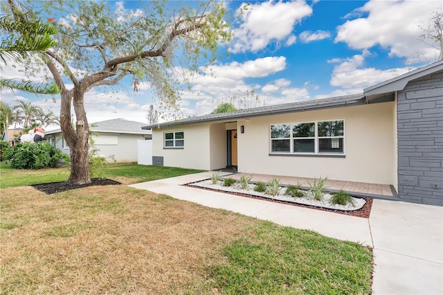 ranch-style home with a front yard