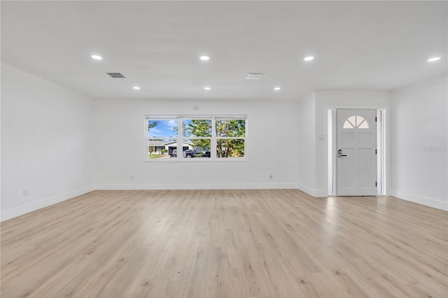 unfurnished living room with light hardwood / wood-style floors