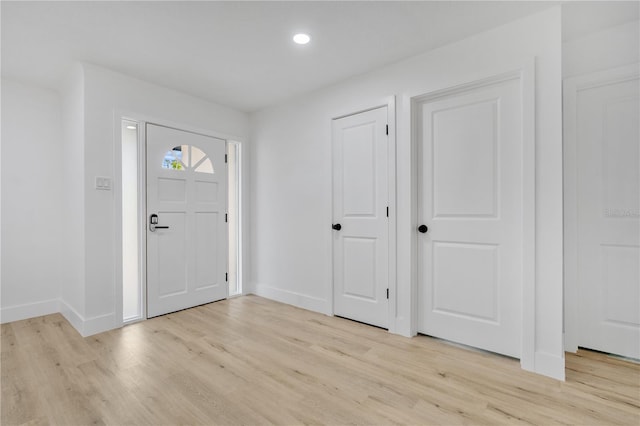 entryway with light hardwood / wood-style floors