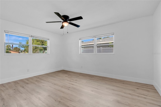 spare room featuring ceiling fan and light hardwood / wood-style flooring