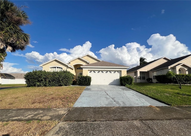 view of front facade with a garage and a front yard