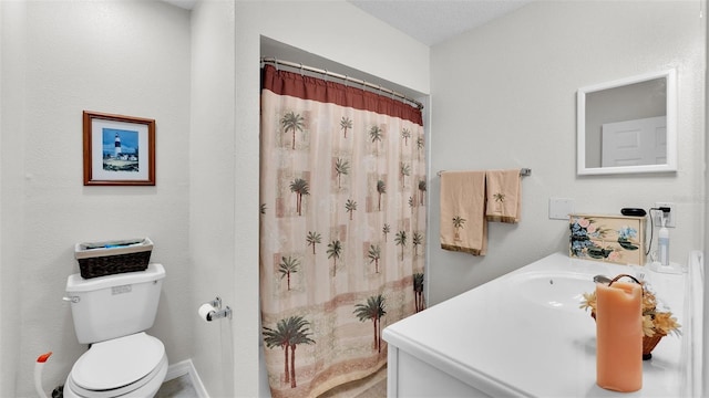 bathroom featuring a shower with shower curtain, vanity, and toilet