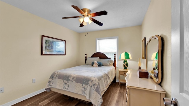 bedroom featuring ceiling fan and dark wood-type flooring