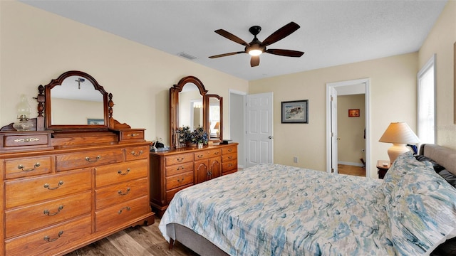 bedroom featuring hardwood / wood-style flooring and ceiling fan