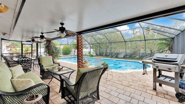 view of swimming pool with a grill, a lanai, and a patio